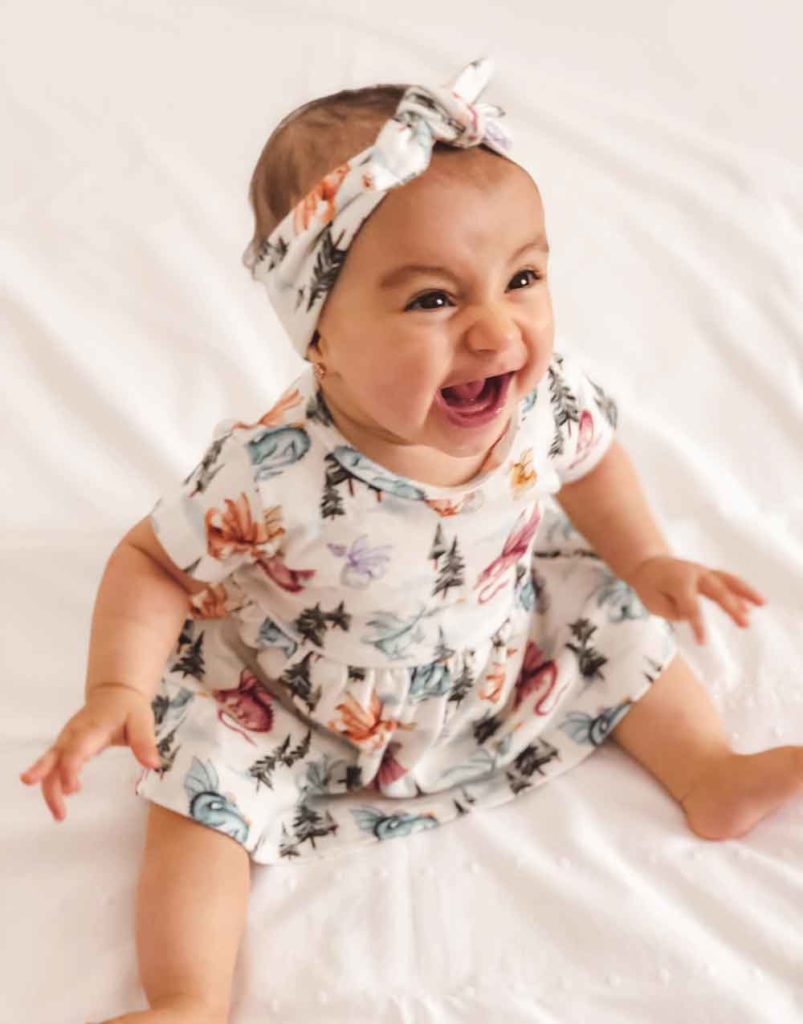 foto bebe menina sorrindo com 6 meses. Vestido The Mini Forest